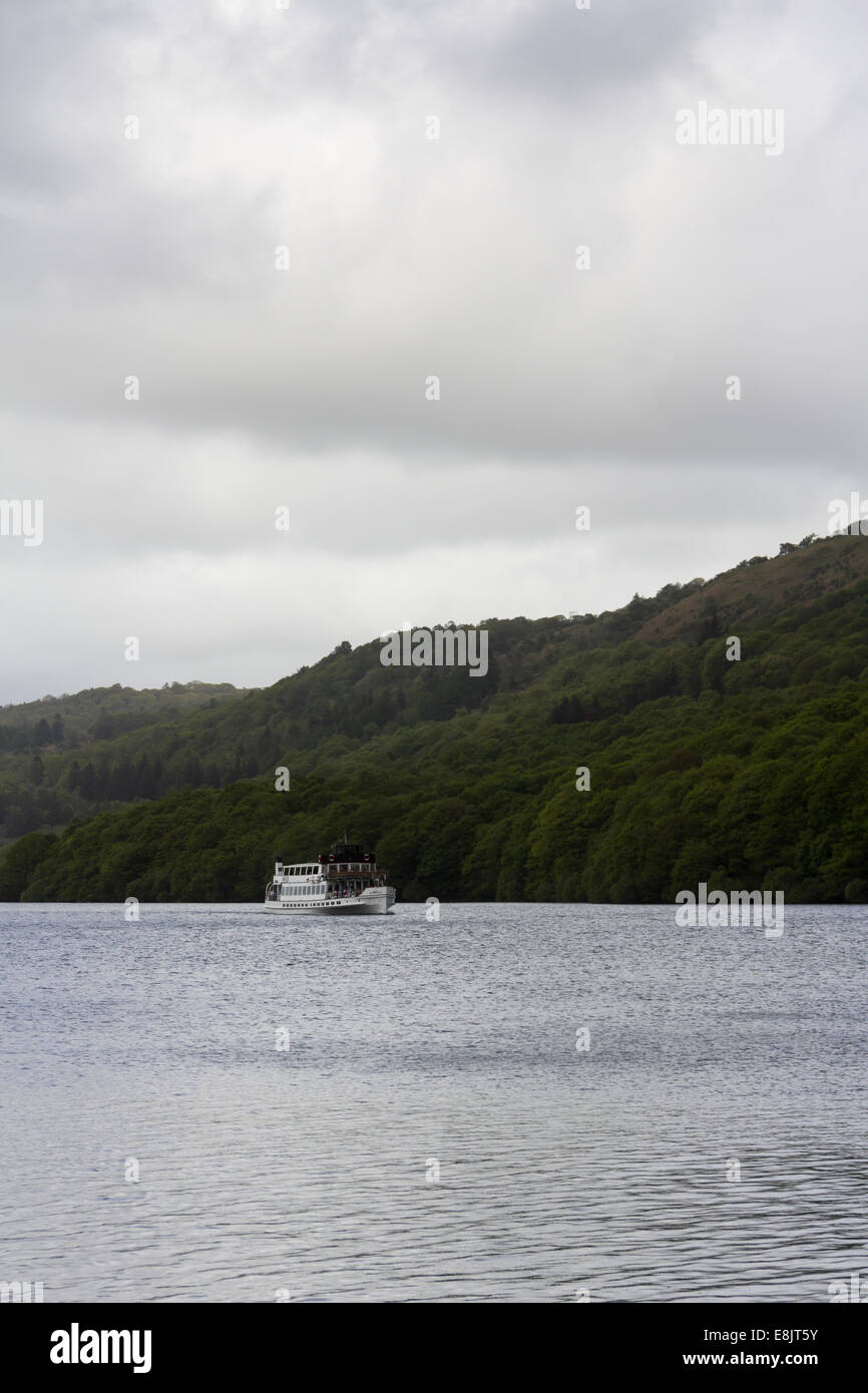 Windermere steamer MV Swan approaching Lakeside at the southern end of Lake Windermere on a dull and wet Spring day. Stock Photo