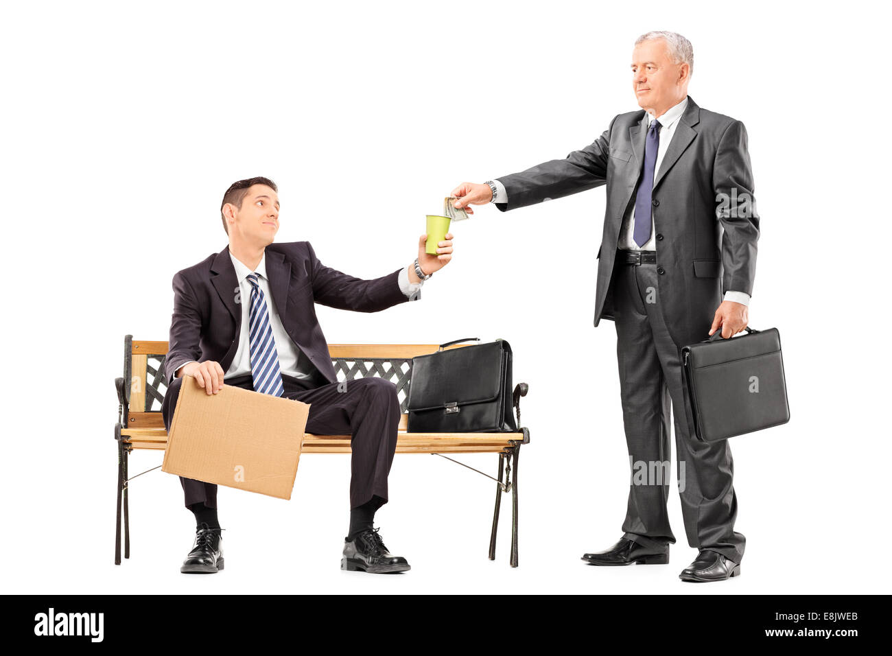 Mature businessman giving some money to a beggar isolated on white background Stock Photo