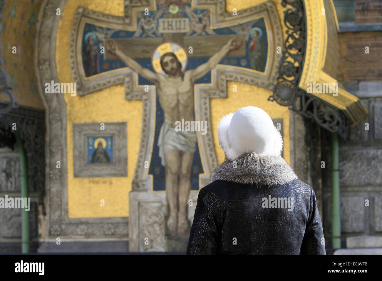 Woman praying in front church hi-res stock photography and images - Alamy, image size:1300x956
