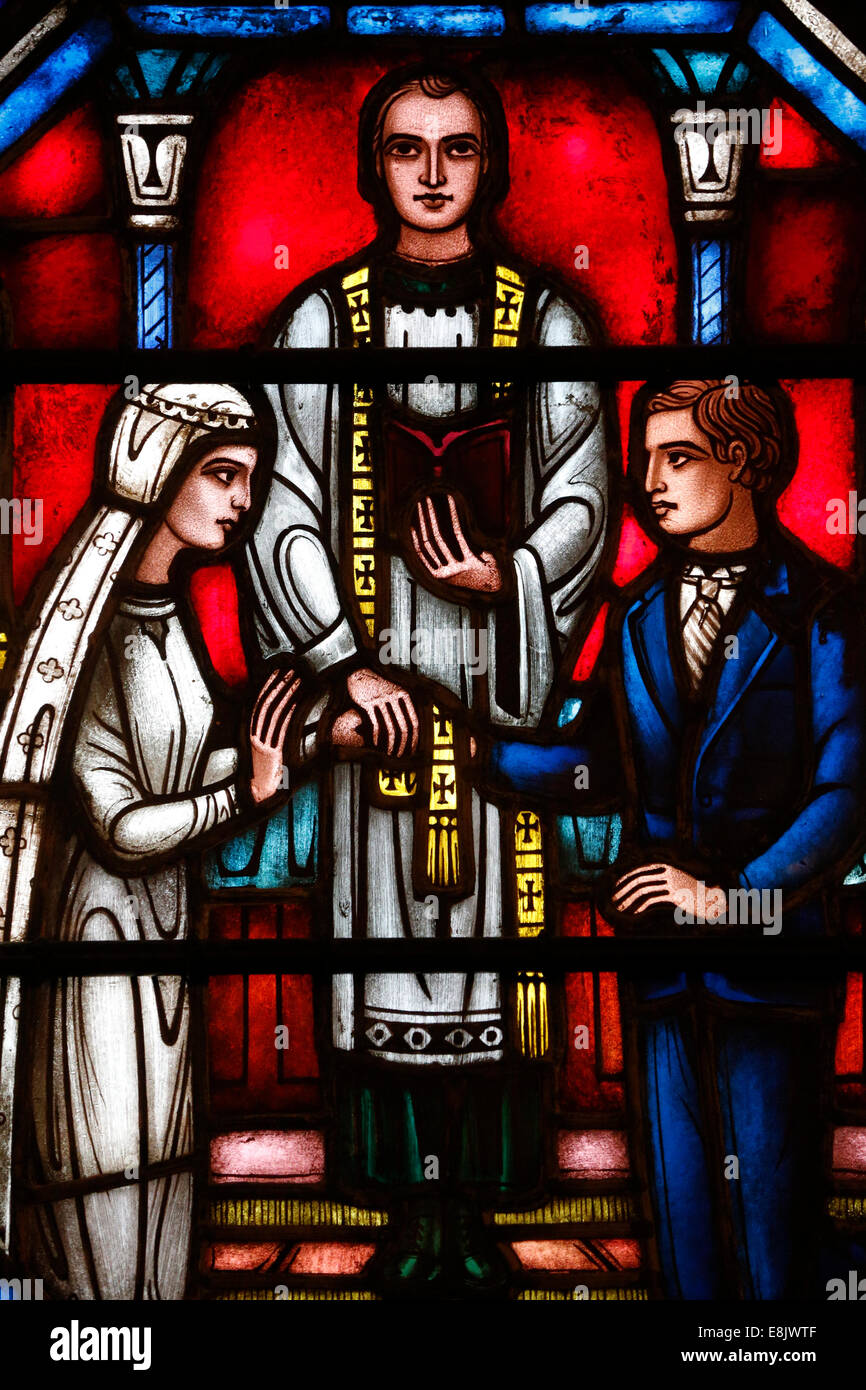 St Barth's church. Stained glass window. Sacrament of Marriage. Stock Photo