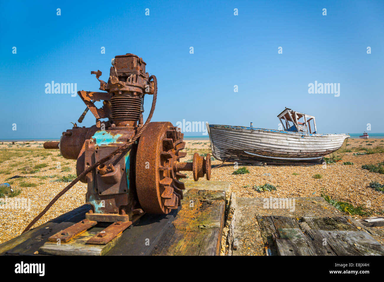 abandoned winch machinery and fishing boat Stock Photo