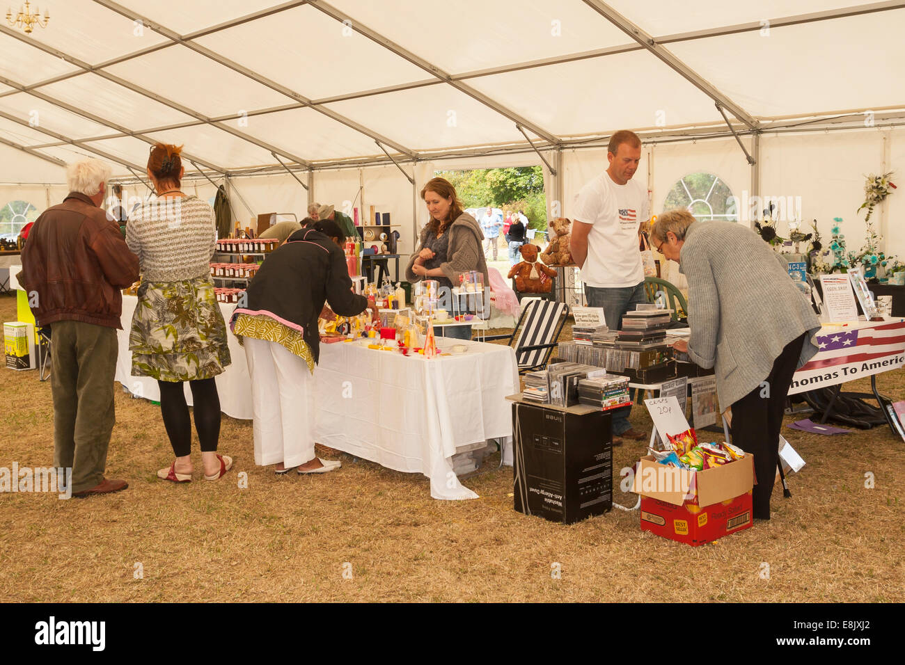 Stall holders and customers at Country Fair Stock Photo Alamy