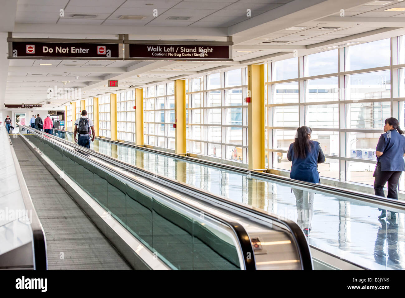 DCA, Reagan National Airport, Washington, DC - Passengers walking through a well lit airport Stock Photo