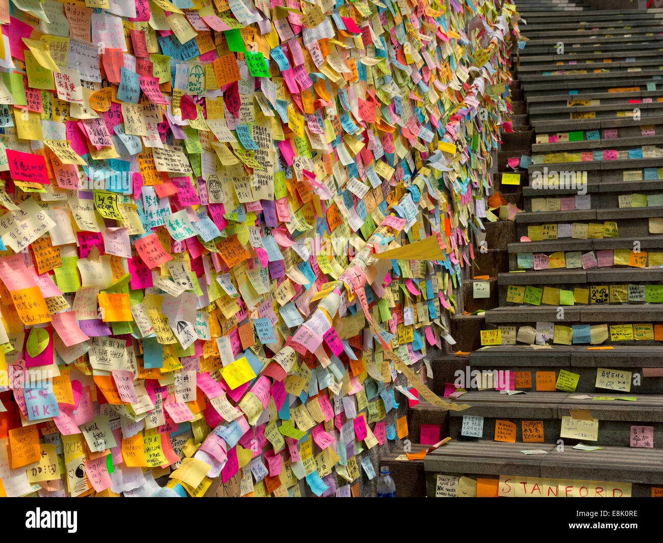 Hong Kong, China. 9th October, 2014. Messages of support for the pro-democracy protests are posted on the walls of the Tamar  government building. The wallhas become known as 'Lennon Wall' and now contains thousands of messages of support for the pro democracy protesters. Stock Photo