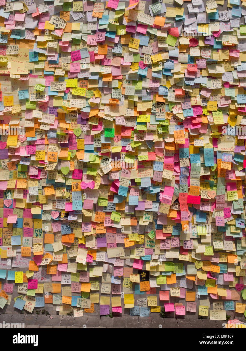 Hong Kong, China. 9th October, 2014. Messages of support for the pro-democracy protests are posted on the walls of the Tamar  government building. The wallhas become known as 'Lennon Wall' and now contains thousands of messages of support for the pro democracy protesters. Stock Photo