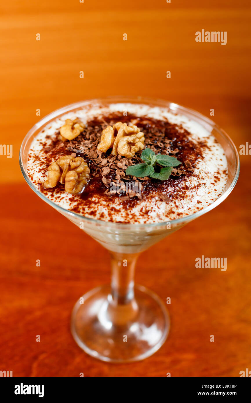 Tiramisu in glass decorated walnut hi-res stock photography and images