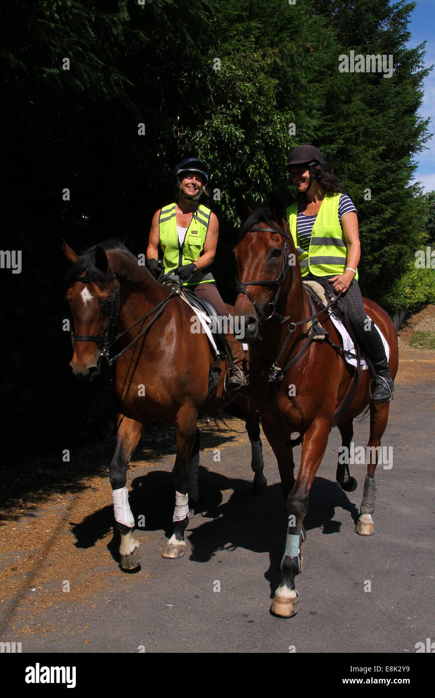Two riders out hacking/riding Stock Photo - Alamy