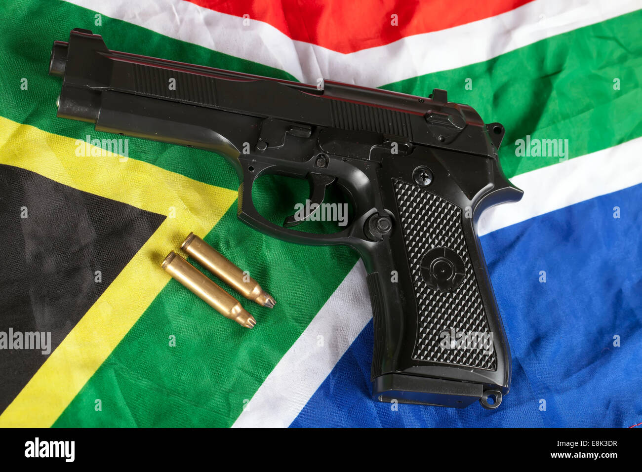 Handgun and brass bullets on South African flag Stock Photo Alamy