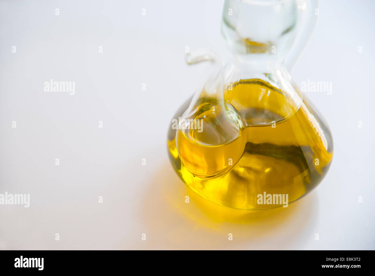 Extra virgin olive oil in oil bottle. Close view. Stock Photo