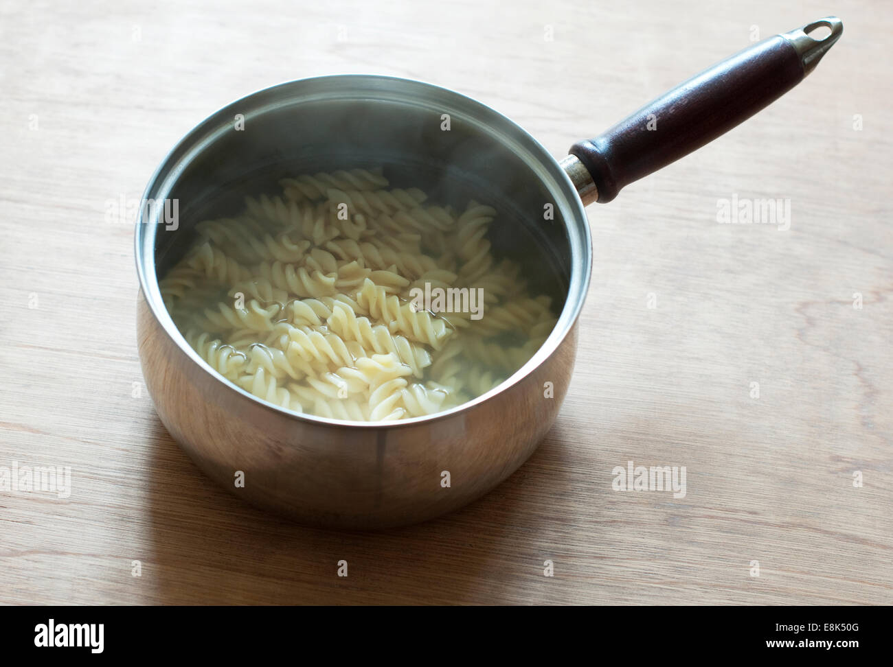 Still life food image of  cooked pasta in a stainless steel saucepan Stock Photo