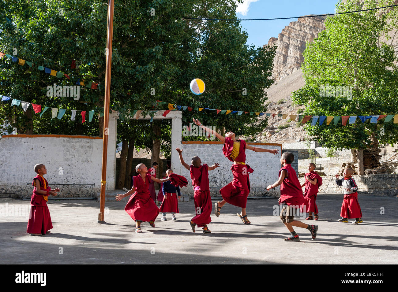 Young monks are play with ball in Key monastery Stock Photo