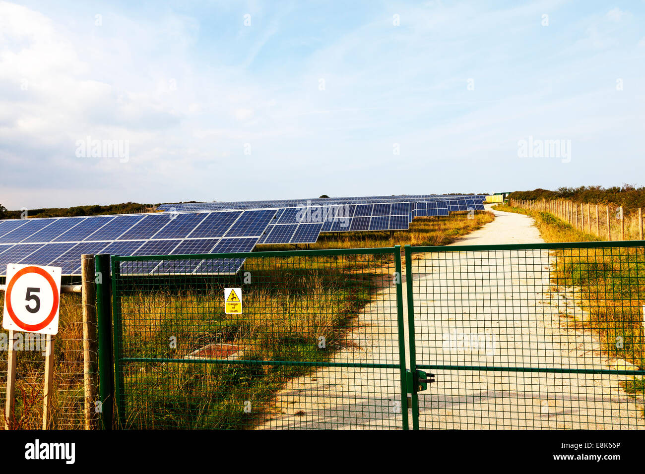 Solar panel panels farm field full Hayle Cornwall Cornish west country typical dramatic electric electricity generators Stock Photo