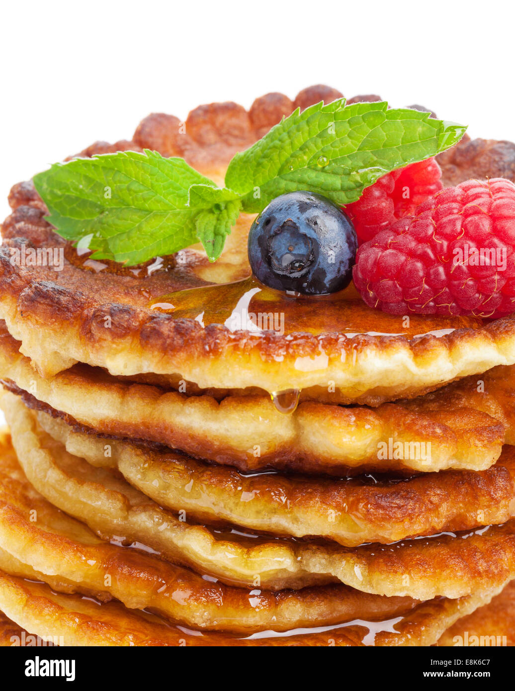 Pancakes Raspberry Blueberries Mint Pancakes with raspberry, blueberry, mint and honey syrup. Isolated on ...