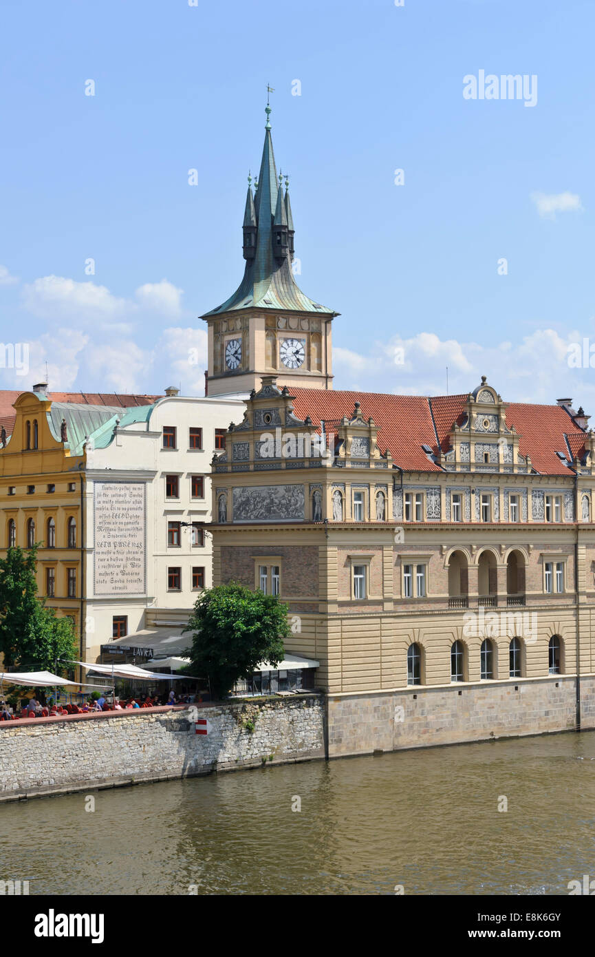 A traditional decorative building with a clock tower by the Vltava river in the City of Prague, Czech Republic. Stock Photo