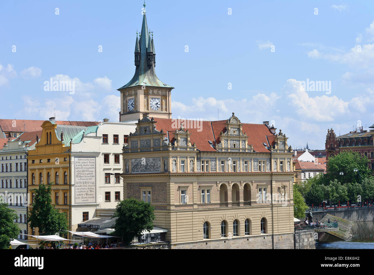 A traditional decorative building with a clock tower by the Vltava river in the City of Prague, Czech Republic. Stock Photo