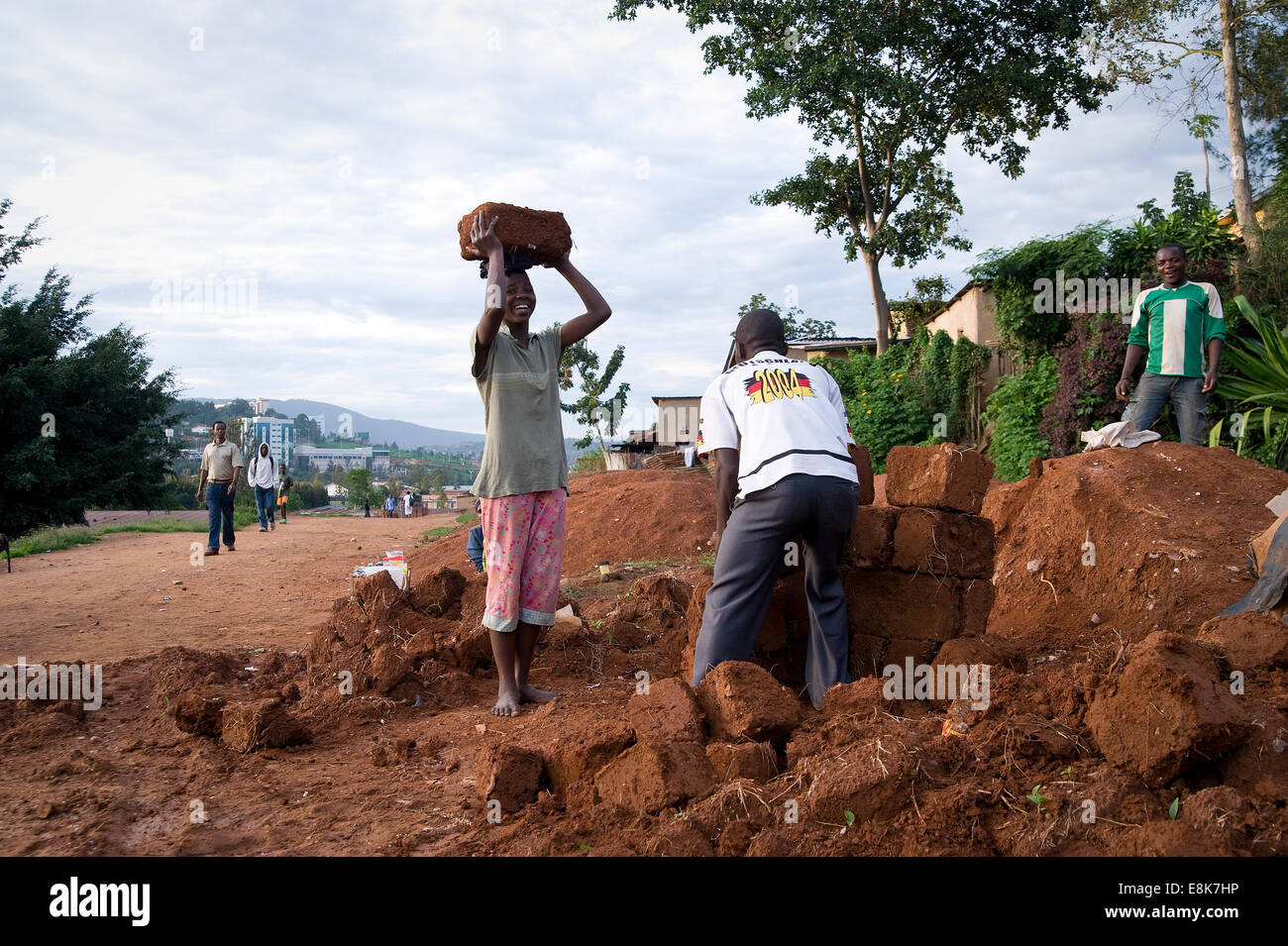 RWANDA, KIGALI: People are making their own mud bricks for building houses. Stock Photo