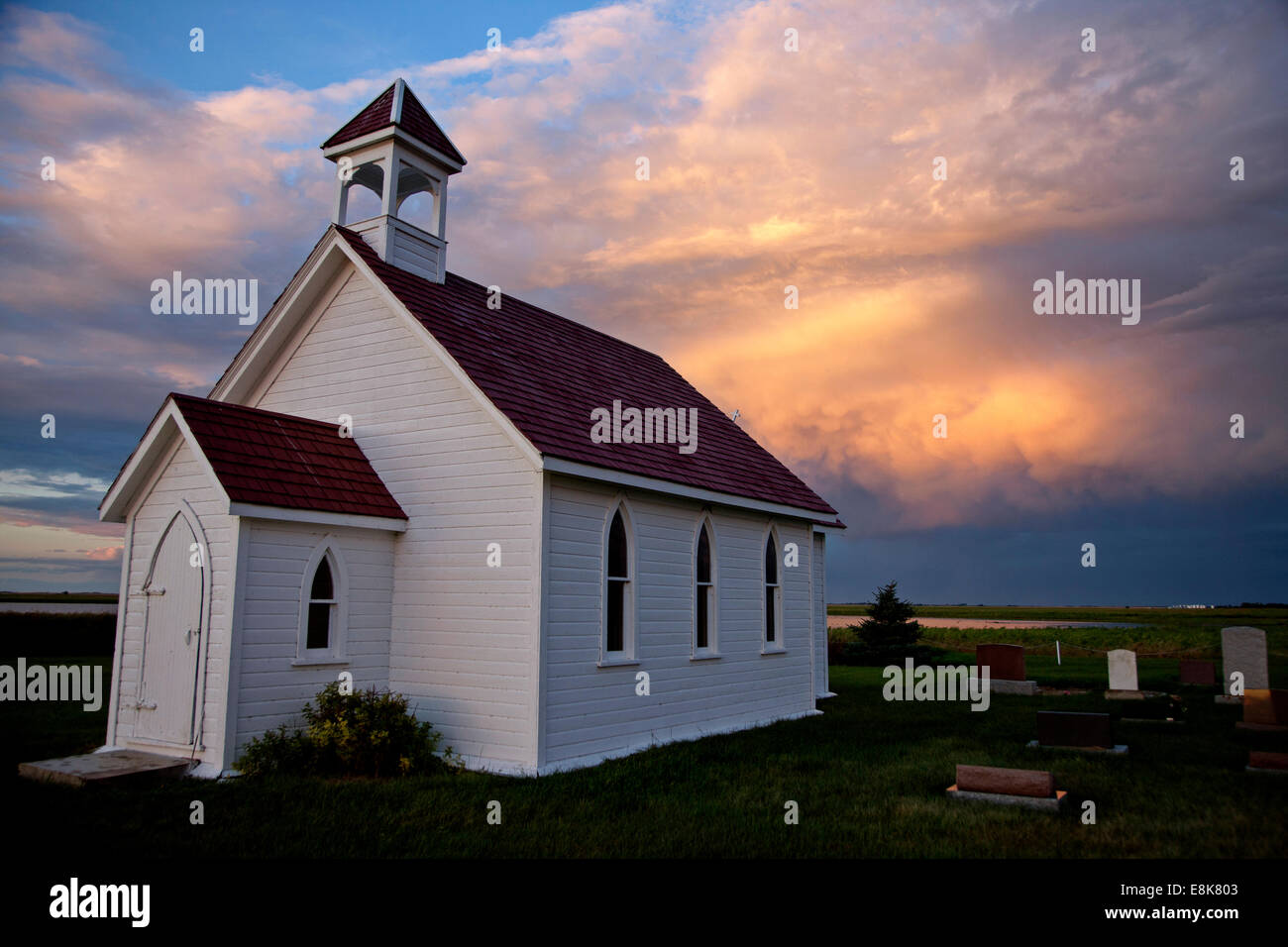 Storm Clouds Saskatchewan with country church and sunset Stock Photo ...
