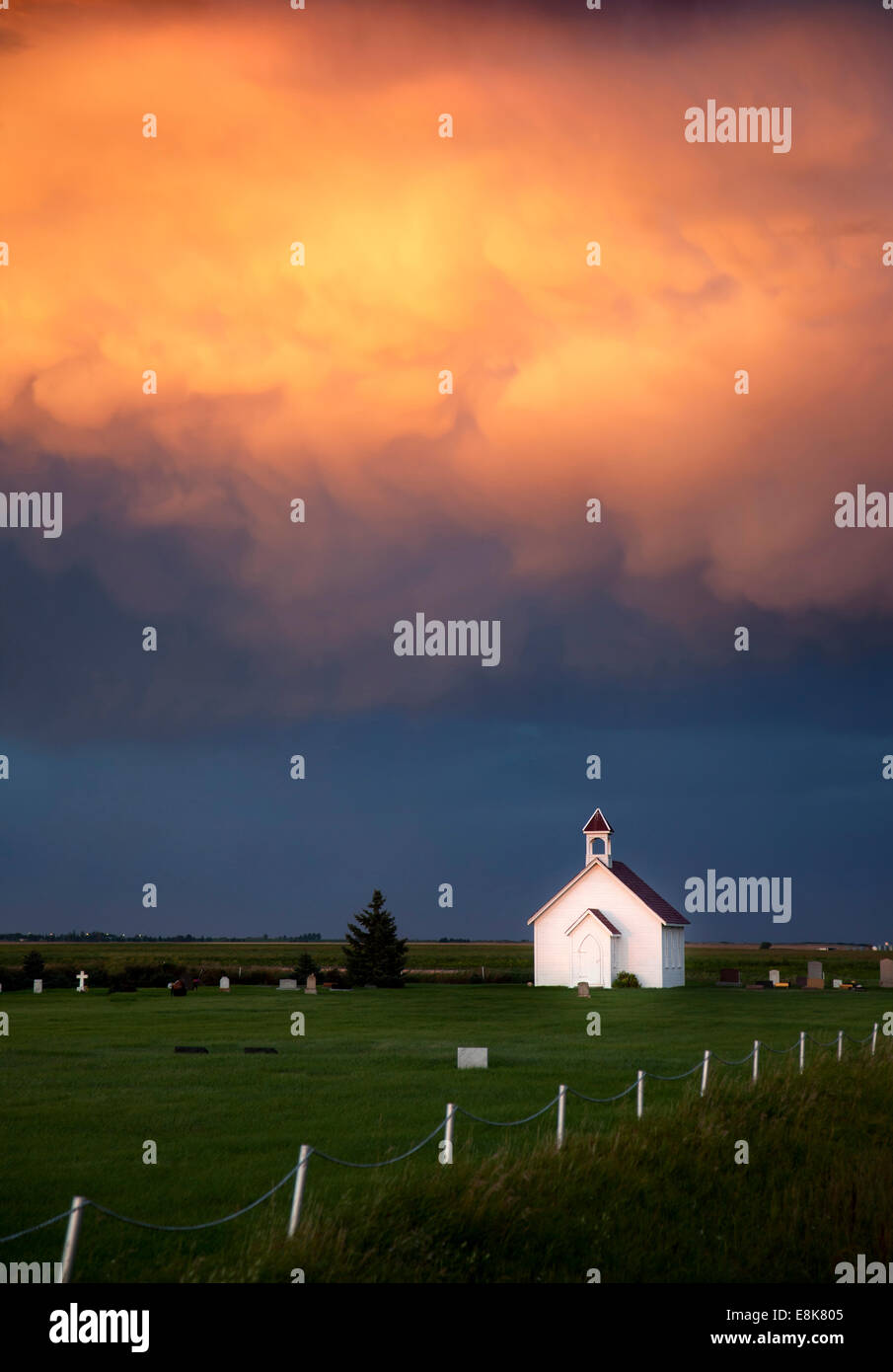 Storm Clouds Saskatchewan with country church and sunset Stock Photo ...