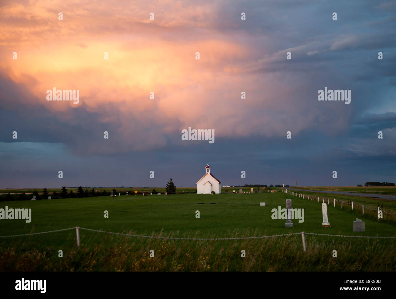 Storm Clouds Saskatchewan with country church and sunset Stock Photo ...