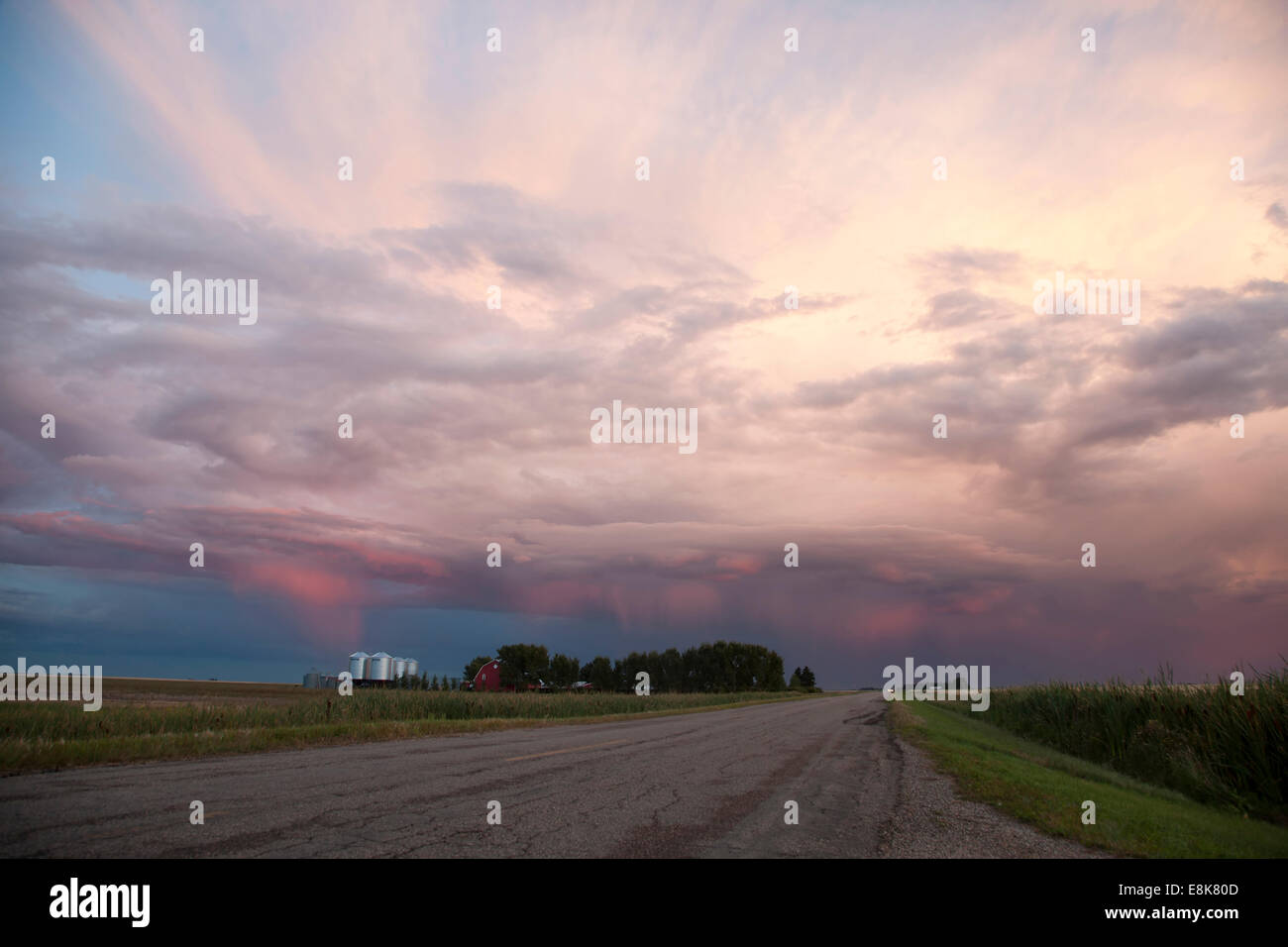 Storm Clouds Saskatchewan and paved road and farm house Stock Photo - Alamy