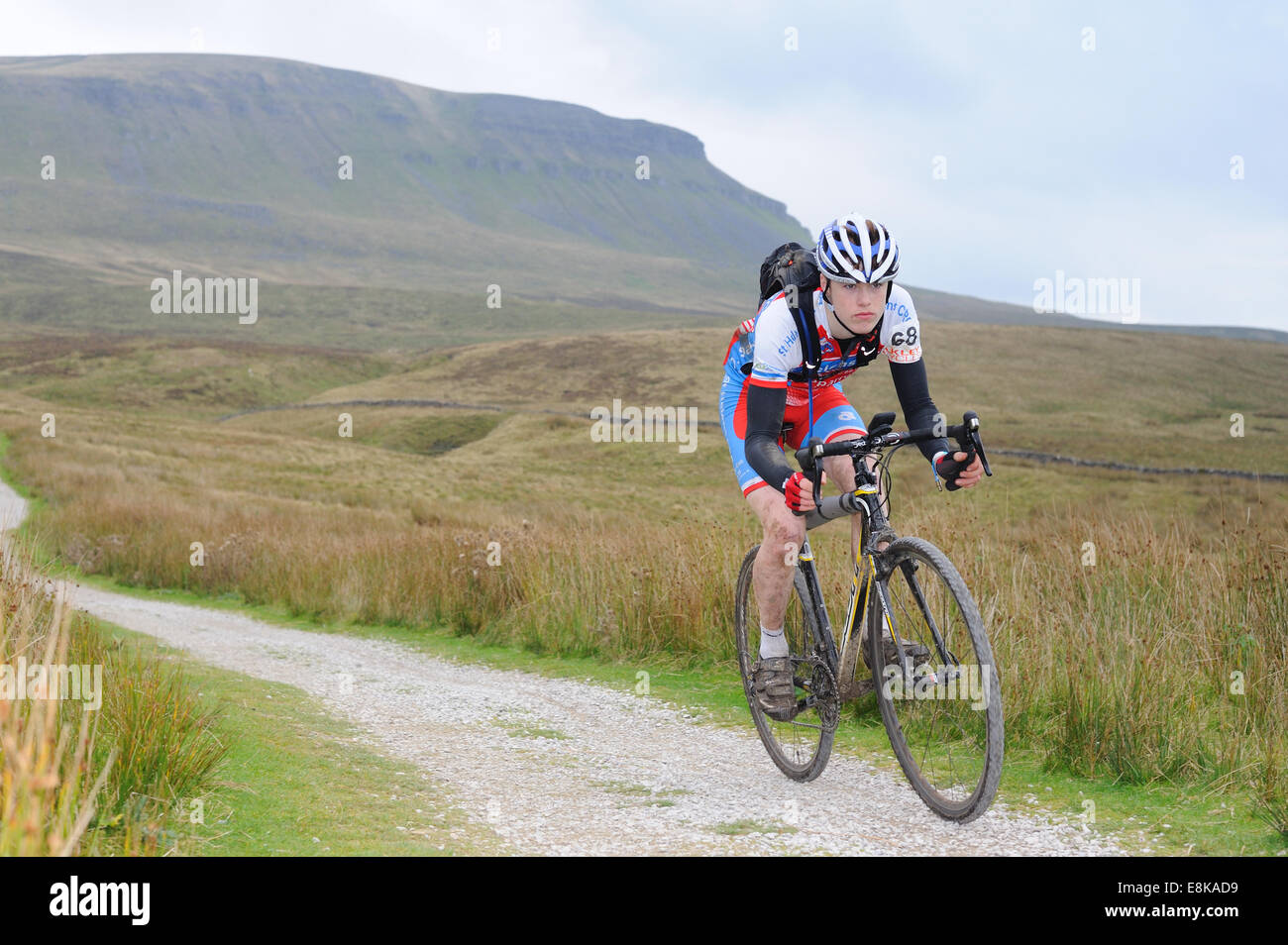 Cyclist in the Three Peaks Cyclocross race with Pen y Gent in the background Stock Photo