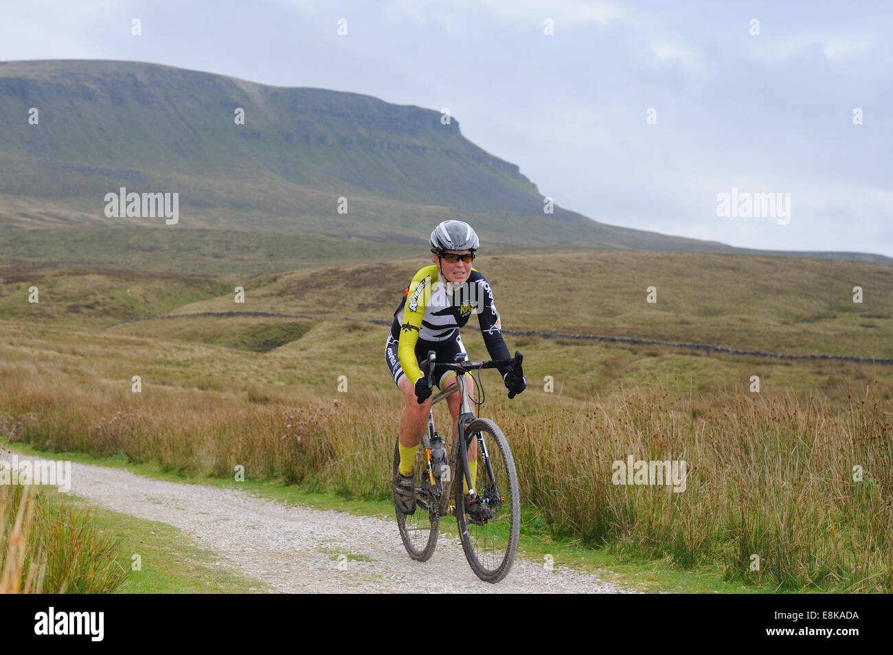 Cyclist in the Three Peaks Cyclcross race with Pen y Gent in the background Stock Photo