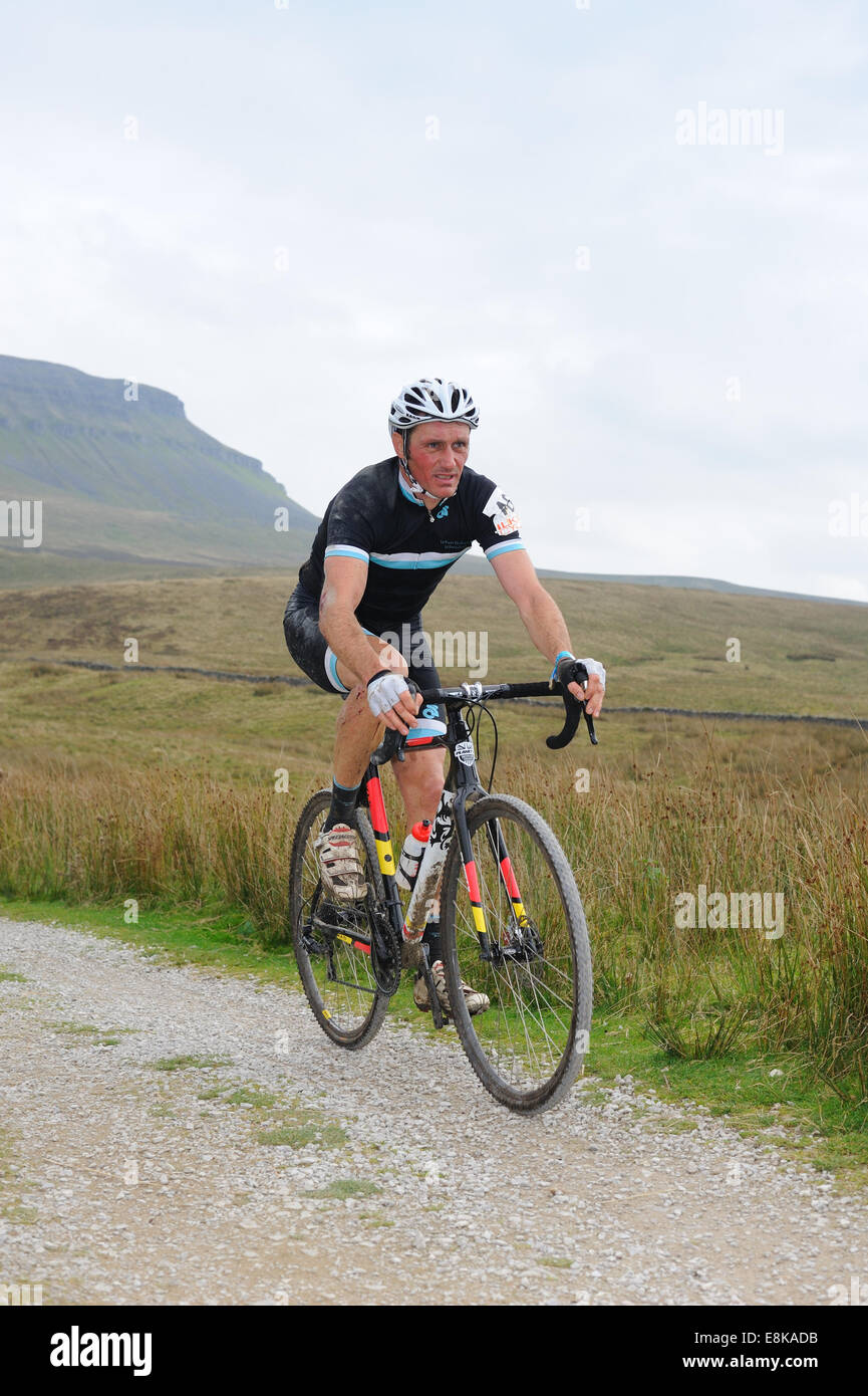 Rider in the Three Peaks cyclocross race with Pen y Gent in the background Stock Photo
