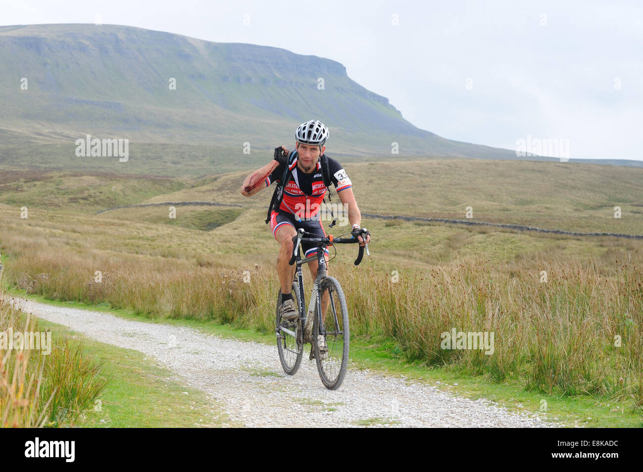 Rider in the Three Peaks Cyclocross race with Pen y Gent in the background Stock Photo