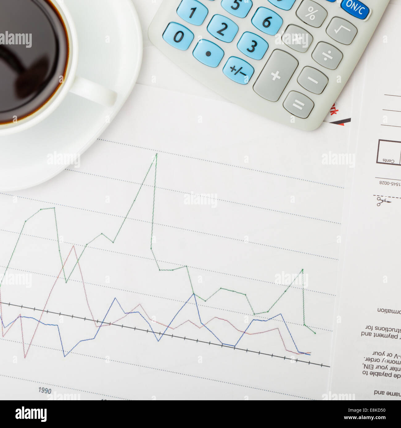 Coffee cup over some financial charts view from top 1 to 1 ratio