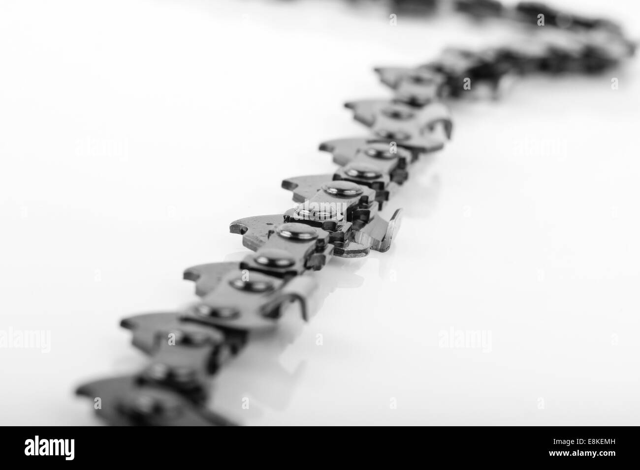 steel metal sharp chain saw pattern on white background as industry concept Stock Photo