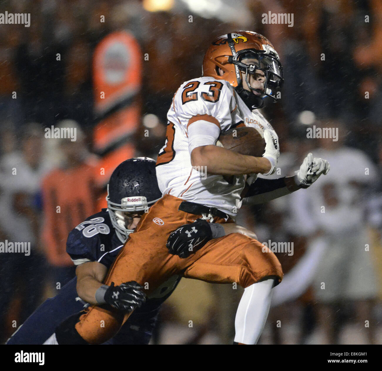 Usa. 9th Oct, 2014. SPORTS -- Eldorado's Dominic Sandoval, 23, is tackled by La Cueva's Beau Lamey, 28, during the game at Wilson Stadium on Thursday, October 9, 2014. © Greg Sorber/Albuquerque Journal/ZUMA Wire/Alamy Live News Stock Photo