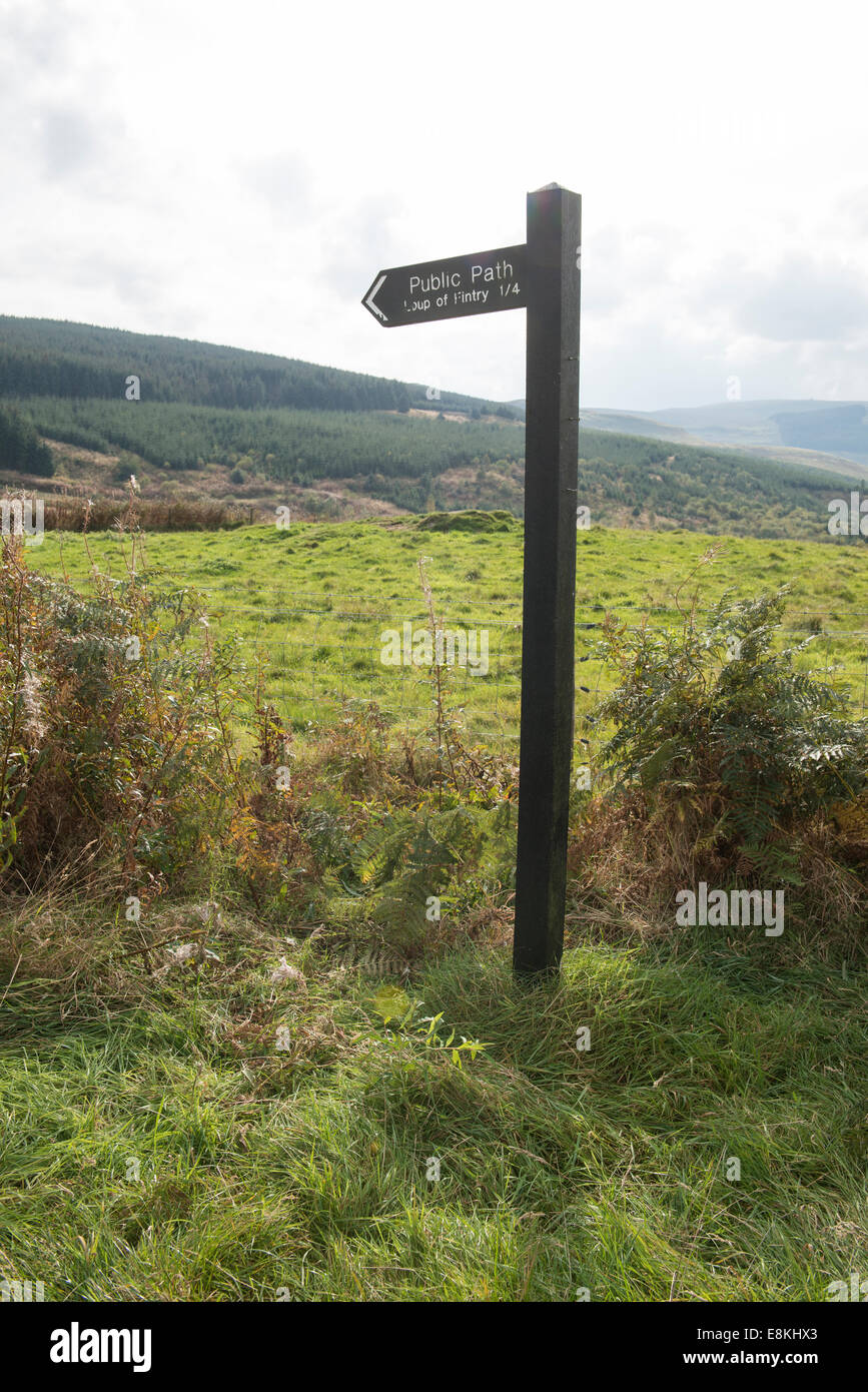 A wooden public path sign in the Scottish countryside. Marking the Loup of Fintry country walk. Stock Photo