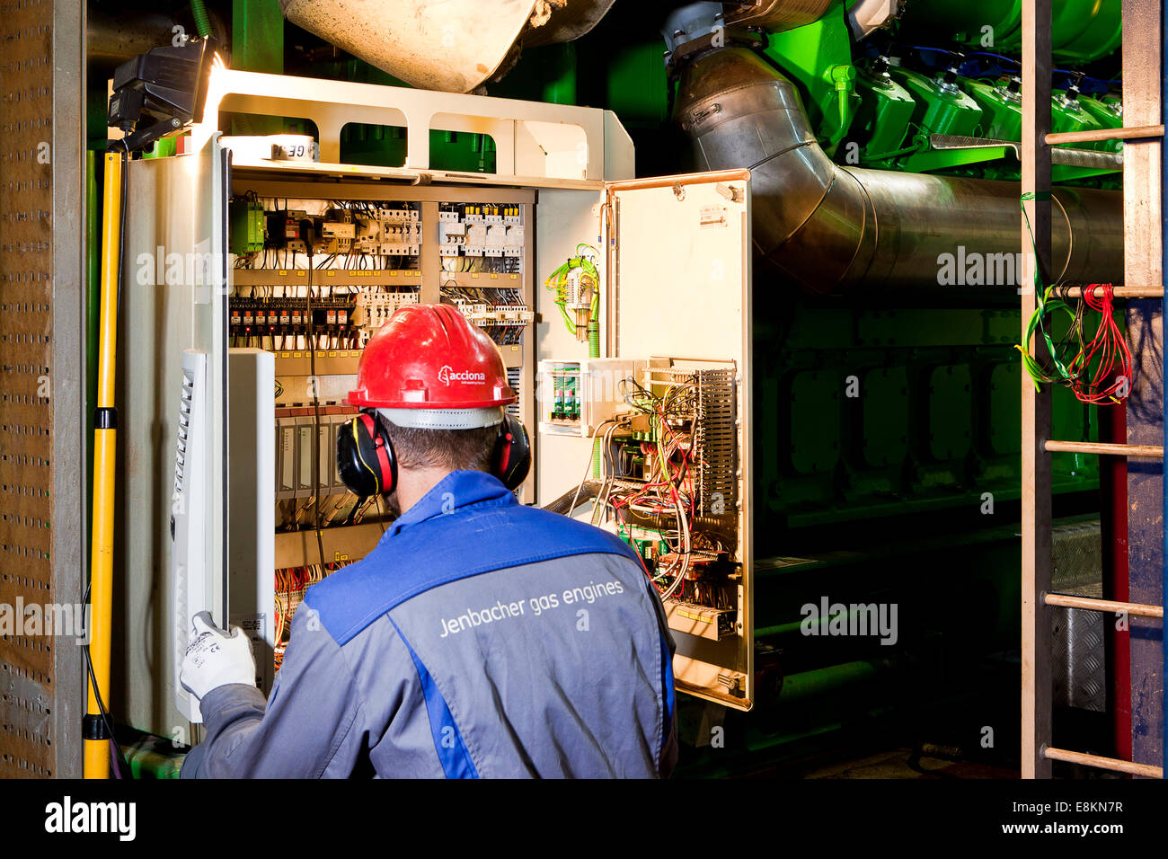 Technician looking for faults, switch box of a gas engine, Landfrischmolkerei dairy, Wels, Upper Austria, Austria Stock Photo