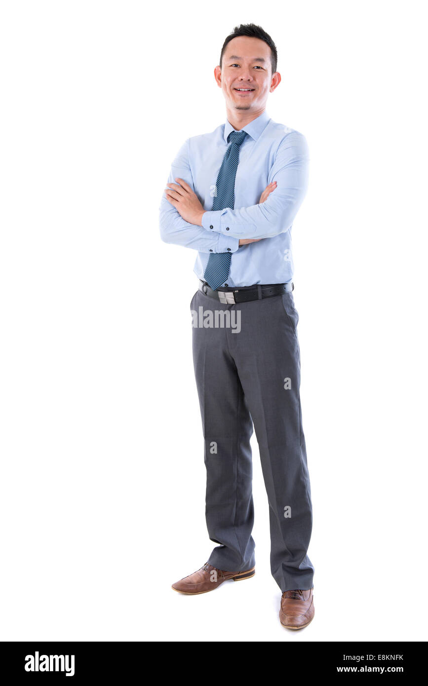 Middle aged Asian business man smiling, full length standing isolated ...