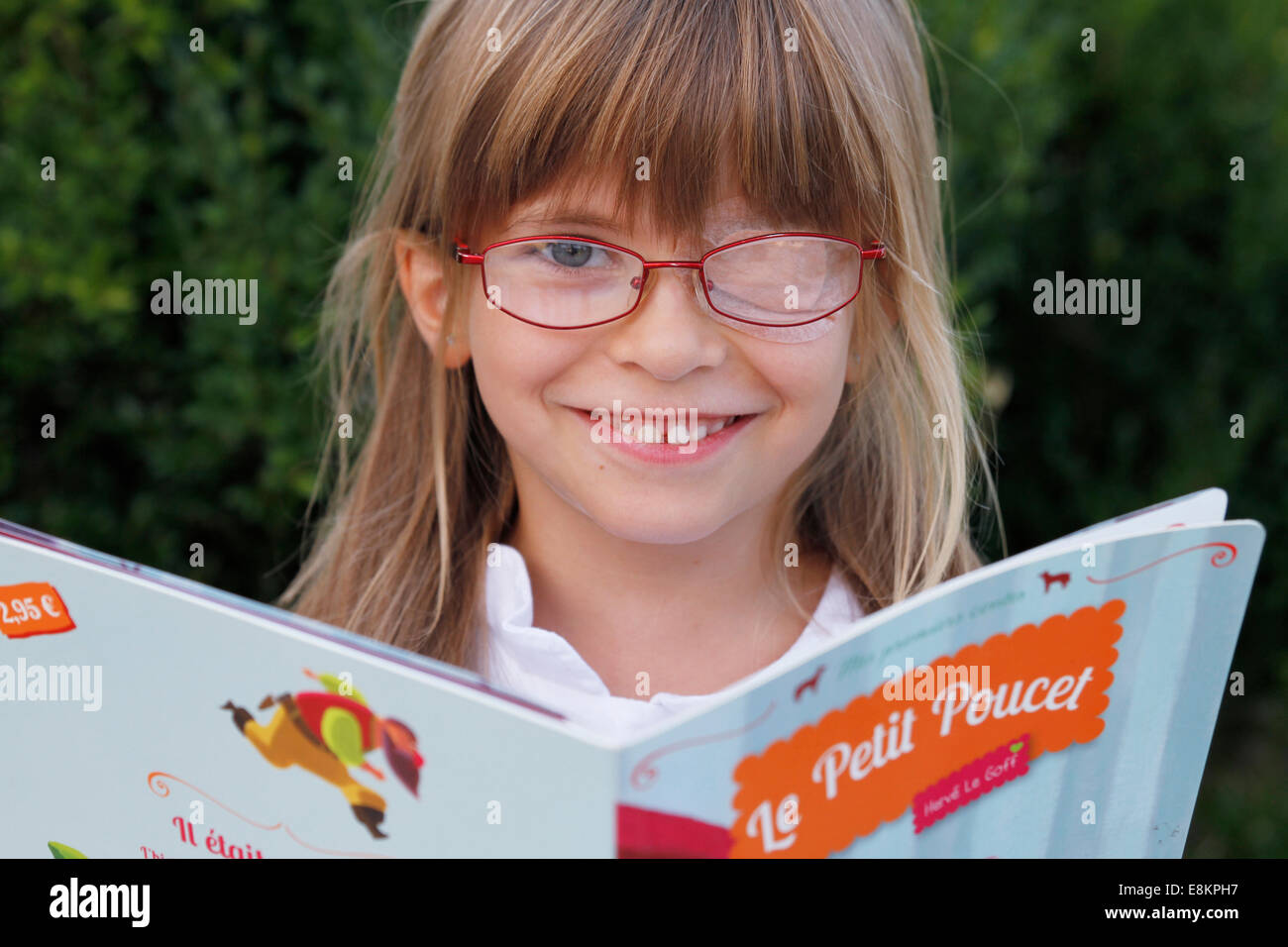 A 6-year old girl wearing an opaque eyepatch to re-educate the amblyopia. Stock Photo