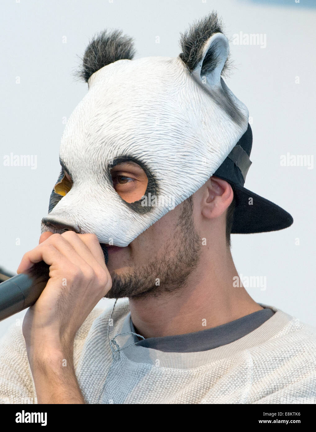 Rapper 'Cro' performs during the Frankfurt Book Fair wearing his panda mask  in Frankfurt/Main, Germany, 09 October 2014. Photo: Boris Roessler/dpa  Stock Photo - Alamy