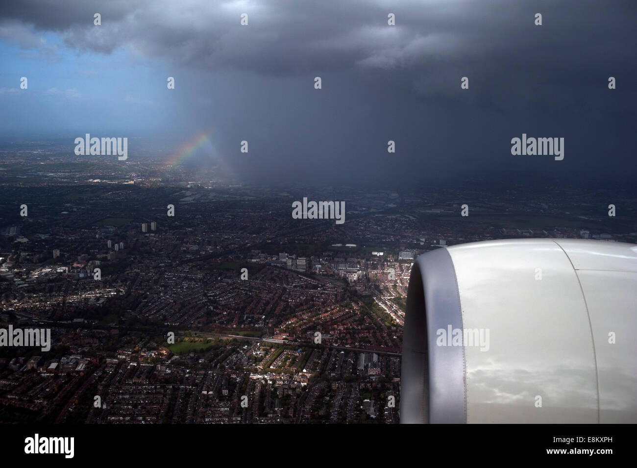London, England, United Kingdom, 09 October 2014. UK weather: Rainbow & rain over London from a passenger plane landing at Heathrow airport. Credit:  David Hodges/Alamy Live News Stock Photo
