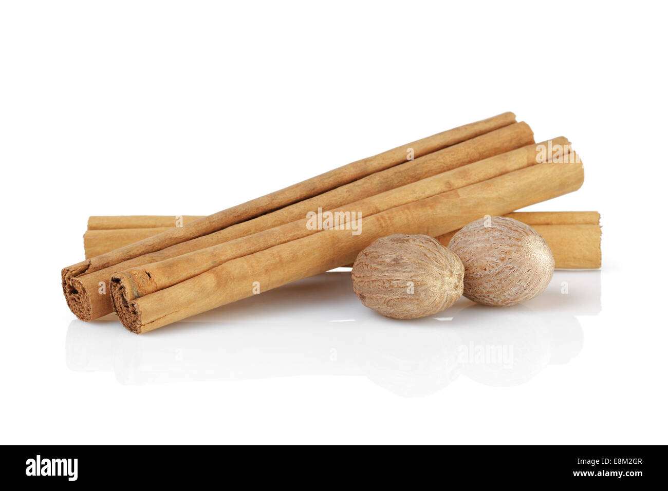true ceylon cinnamon sticks with nutmeg, isolated on white Stock Photo
