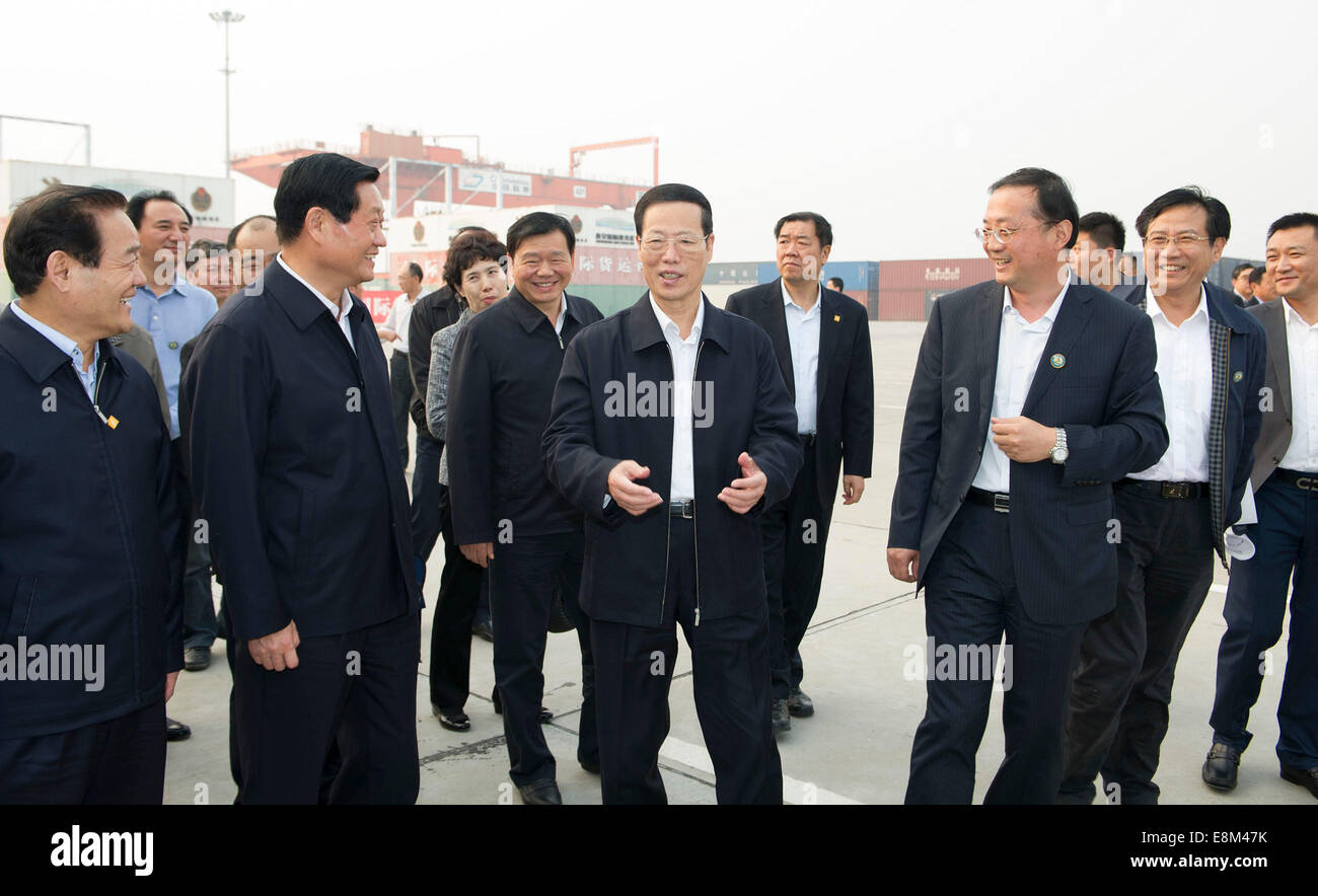 Xi'an, China's Shaanxi Province. 9th Oct, 2014. Chinese Vice Premier Zhang Gaoli (C, front) visits the railway container center at the International Trade and Logistics Park of Xi'an, capital of northwest China's Shaanxi Province, Oct. 9, 2014. Zhang visited Xi'an for a symposium on the development of a 'Silk Road Economic Belt' and a '21st Century Maritime Silk Road' on Friday. Credit:  Huang Jingwen/Xinhua/Alamy Live News Stock Photo