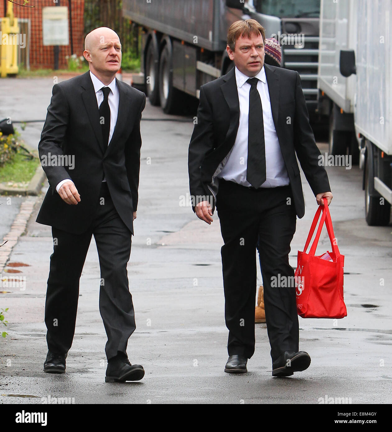 Eastenders cast film scenes for Lucy Beale's funeral  Featuring: Adam Woodyatt,Jake Wood Where: London, United Kingdom When: 07 Apr 2014 Stock Photo