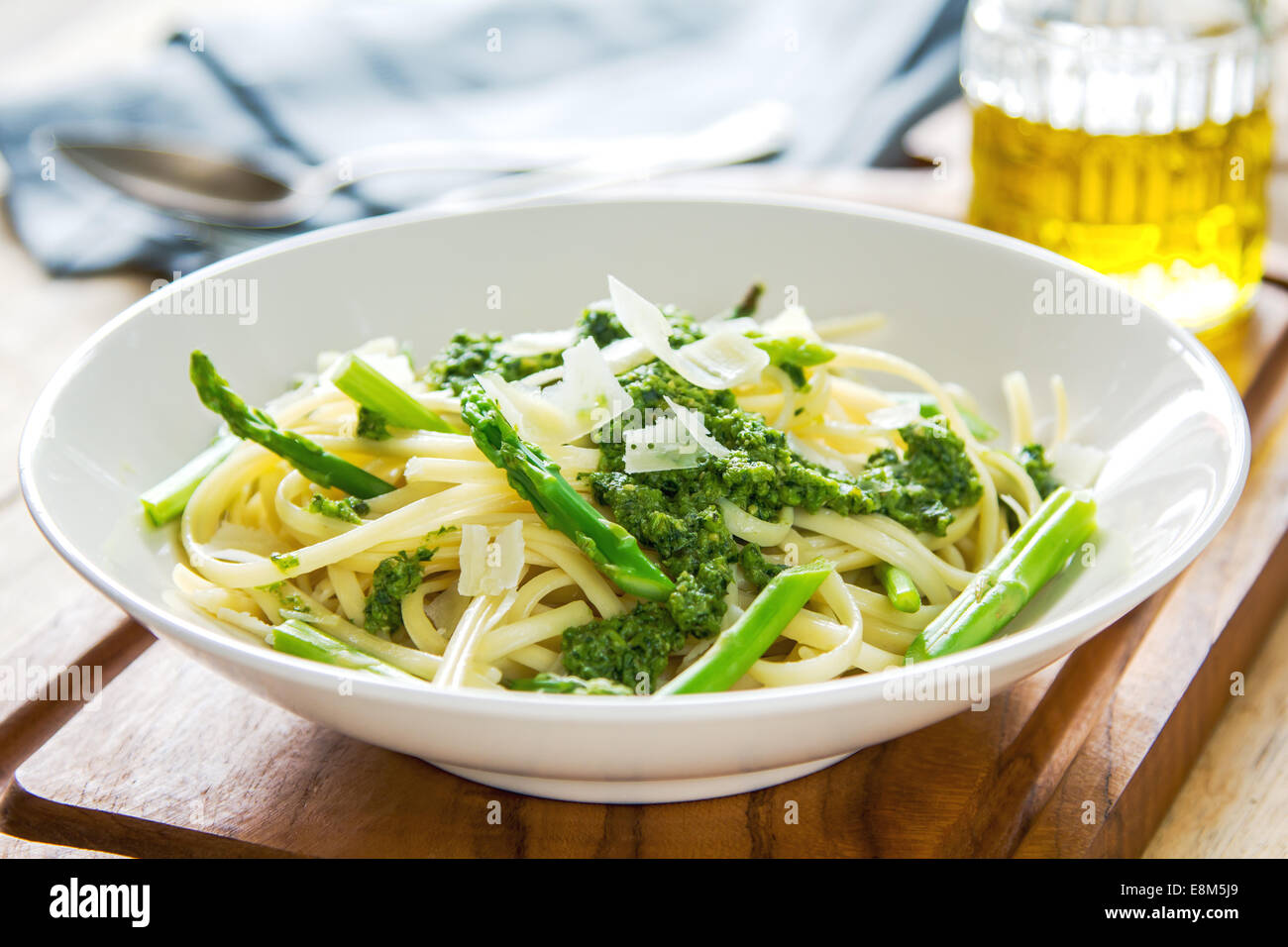 Fettuccine in Asparagus pesto with shaving parmesan on top Stock Photo