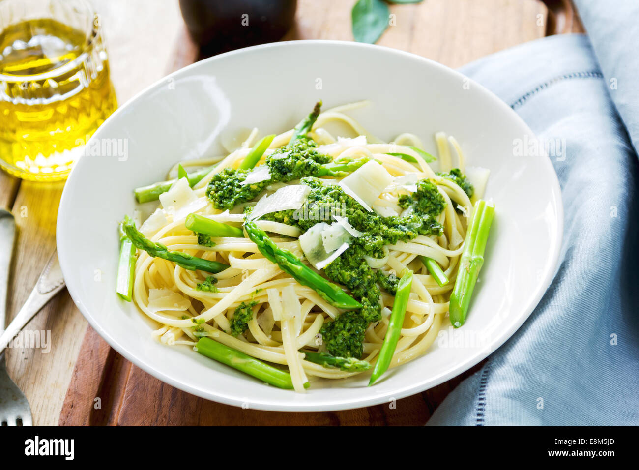 Fettuccine in Asparagus pesto with shaving parmesan on top Stock Photo