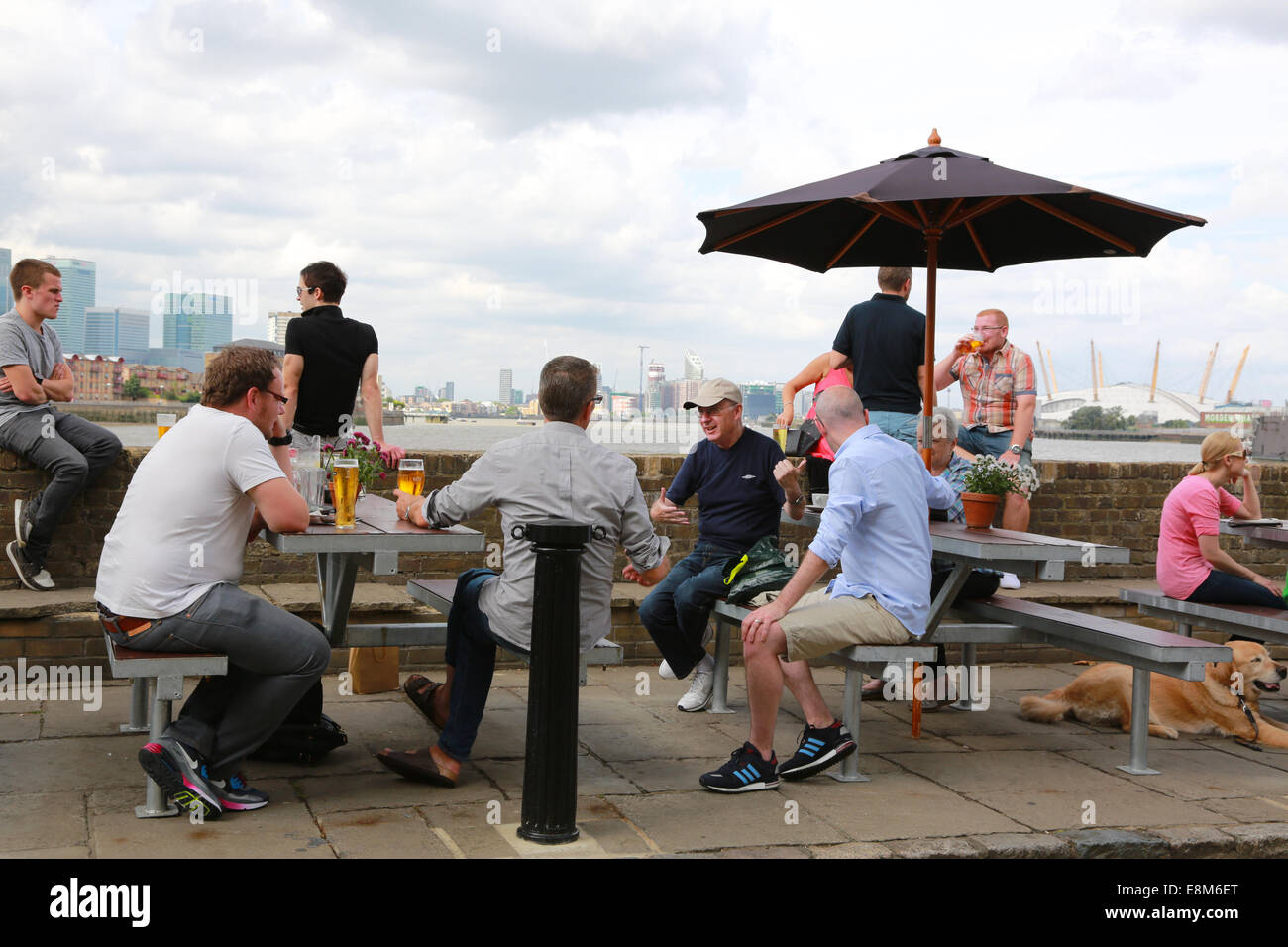Men Sitting outside a pub drinking Stock Photo
