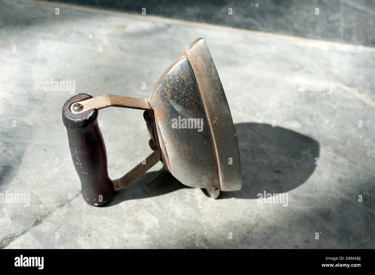 An old battered portable small electric travelling Iron bought to celebrate a Sixth Wedding Anniversary (IRON) Stock Photo