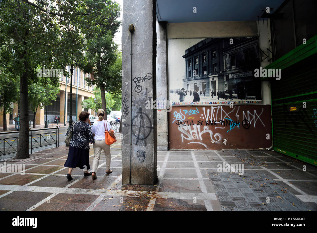 Athens Greece Graffiti Anarchy Symbol Pedestrians On Street Stock Photo