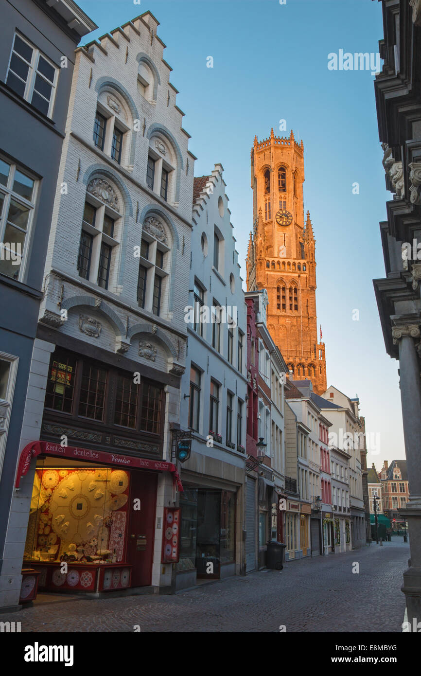 BRUGES, BELGIUM - JUNE 12, 2014: The tower of Belfort van Brugge in the morning light from Breidelstraat Stock Photo