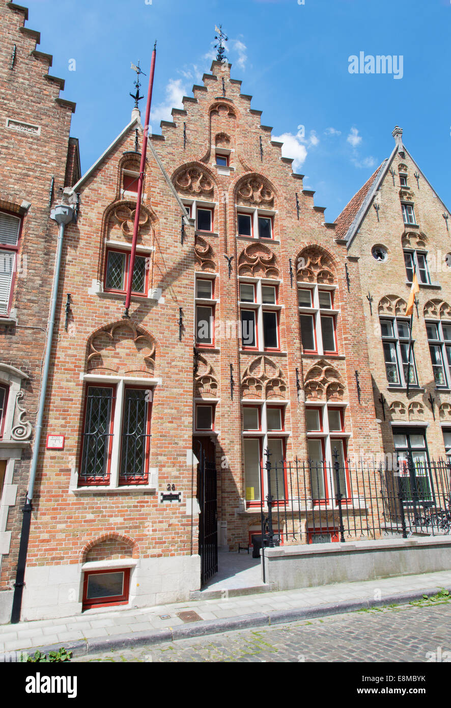 BRUGES, BELGIUM - JUNE 12, 2014: Typicaly brick house on Moerstraat street Stock Photo