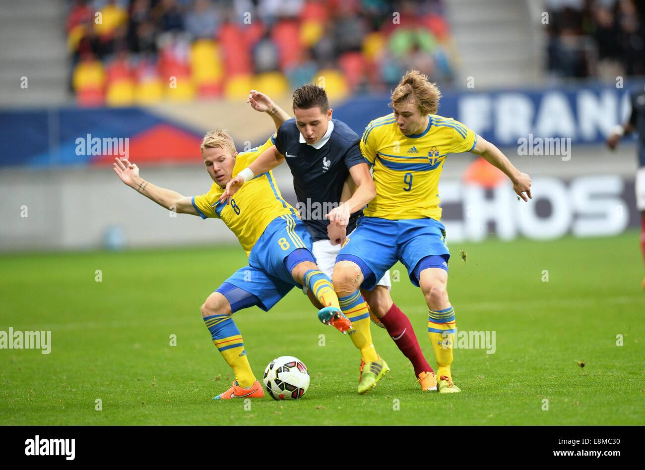 Stade Le Mans, Le Mans, France. 10th Oct, 2014. U23 International football. Euro 2015 Qualification match between France and Sweden. Florian Thauvin (fra) Simon Tibbling (swe) and Oscar Lewicki (swe) Credit:  Action Plus Sports/Alamy Live News Stock Photo