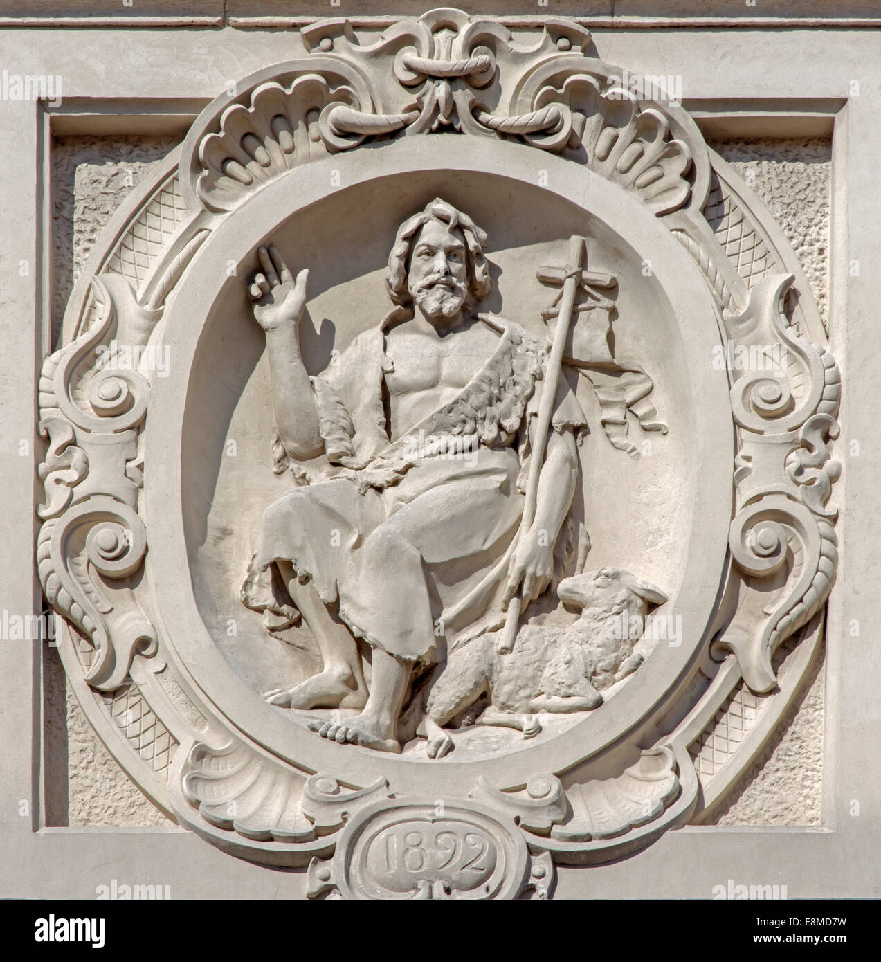 Bruges - The relief of st. John the Baptist on he facade of baroque Carmelites church. Stock Photo