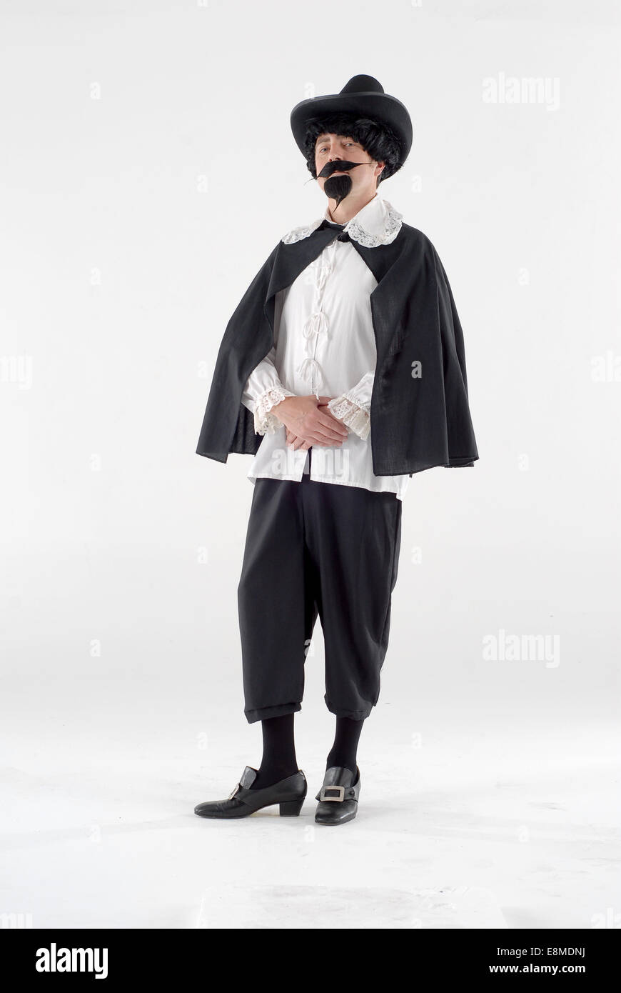 man in fancy dress comedy costume as historical figure kind of like a duchman / Rembrandt Stock Photo